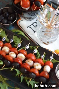 Halloween Antipasto Skewers: Festive Appetizer Ideas for Parties 11 Close up of halloween anitpasto skewers on a plate.