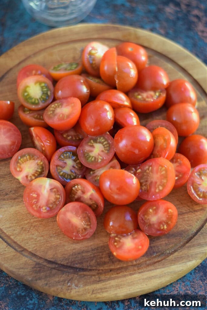 Halloween Antipasto Skewers: Festive Appetizer Ideas for Parties 5 Sliced tomatoes on a wooden board.