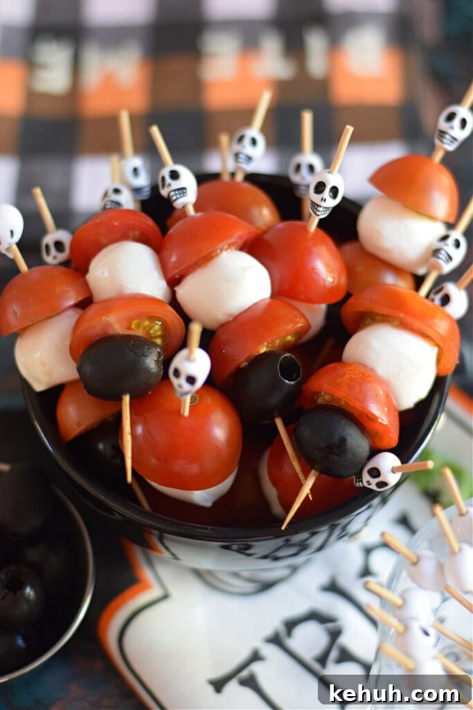 Halloween Antipasto Skewers: Festive Appetizer Ideas for Parties 6 Halloween cocktail sticks in a bowl.