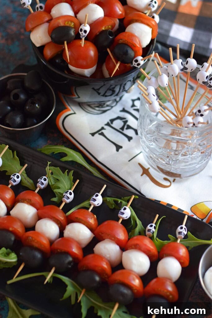 Halloween Antipasto Skewers: Festive Appetizer Ideas for Parties 7 Cheese, tomato and olive skewers.