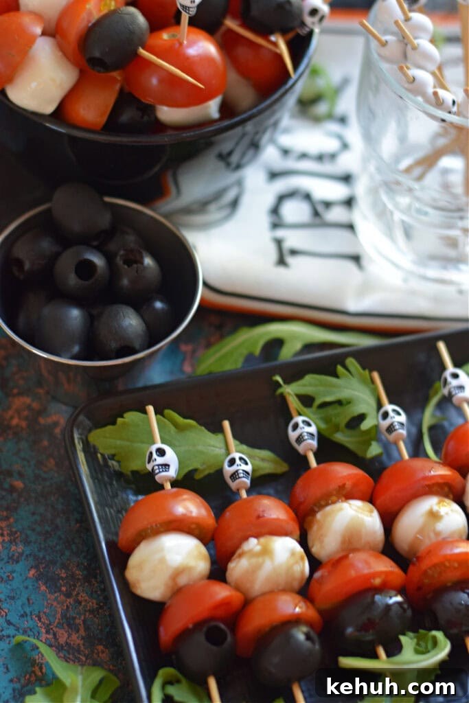 Halloween Antipasto Skewers: Festive Appetizer Ideas for Parties 8 Cherry tomato, cheese and olive skewers.