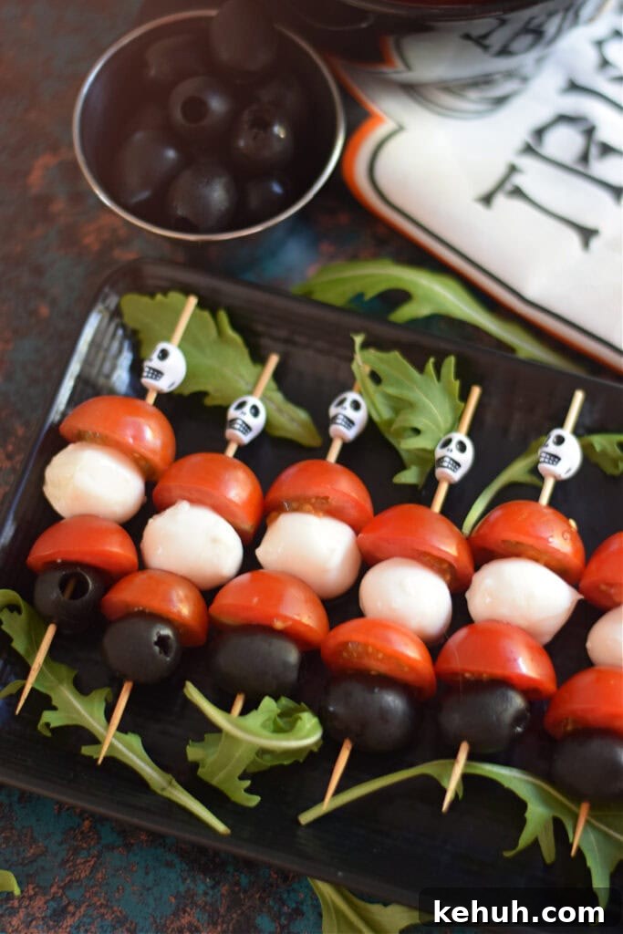 Halloween Antipasto Skewers: Festive Appetizer Ideas for Parties 9 Halloween skewers on a plate.