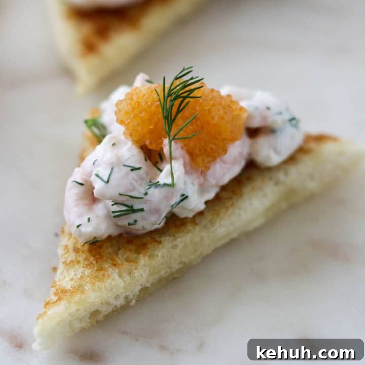 Close up of Toast Skagen topped with caviar.