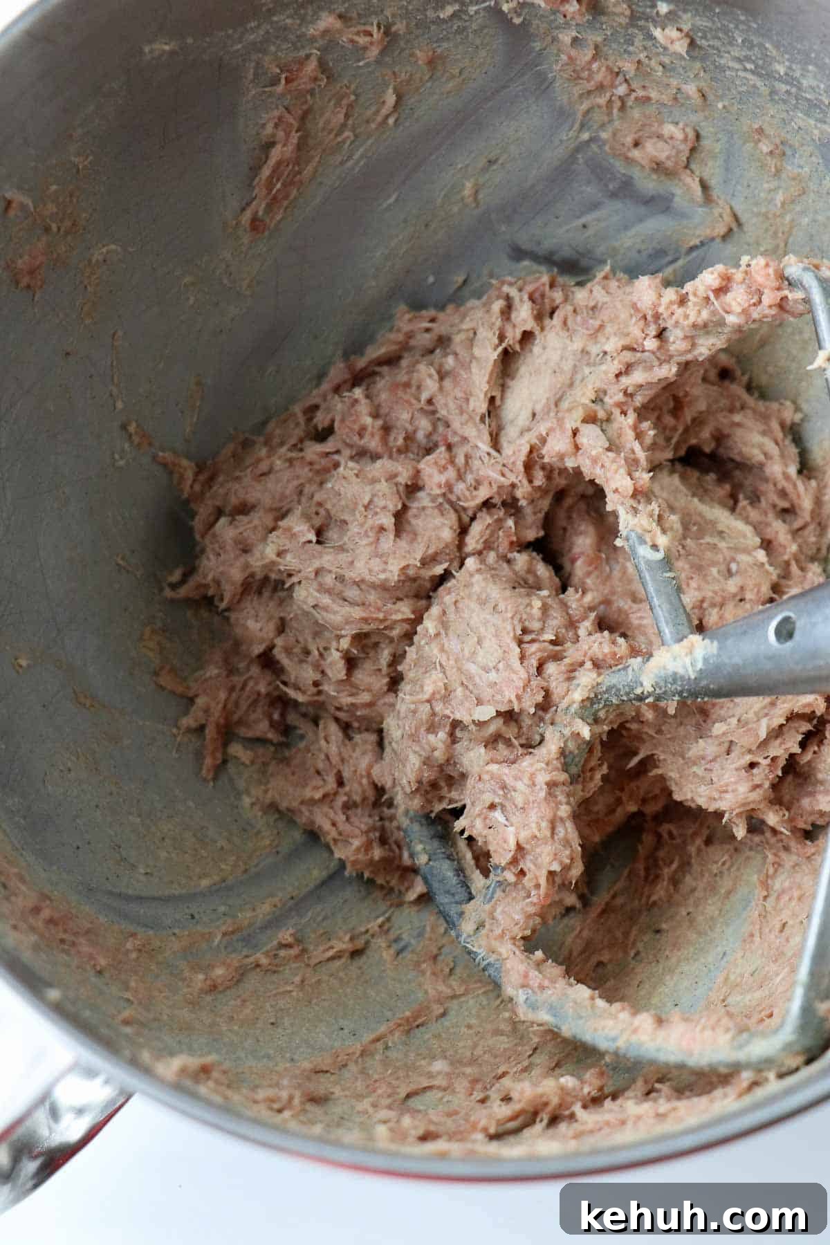 Classic Swedish Meatballs with Creamy Gravy (Köttbullar) 8 Mixed ingredients for Swedish Meatballs in a metal bowl with a paddle attachment.