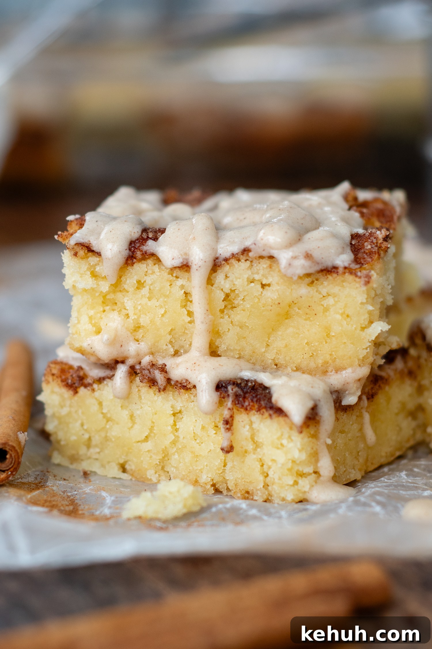 Gooey Snickerdoodle Bars with Cinnamon Frosting Recipe 2 two bars stacked on top of each other with frosting dripped.