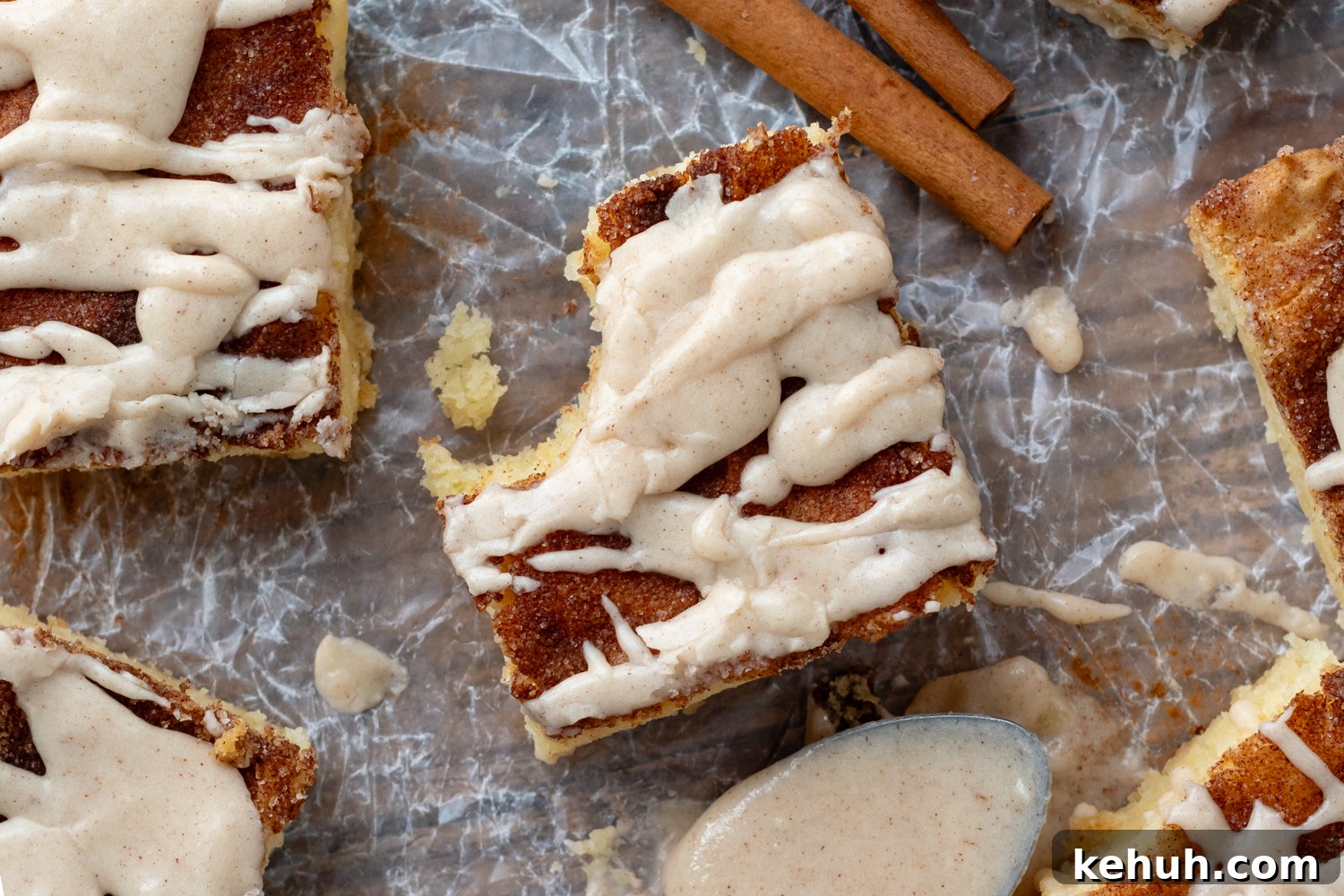 Gooey Snickerdoodle Bars with Cinnamon Frosting Recipe 3 top view of bar with cinnamon sticks.