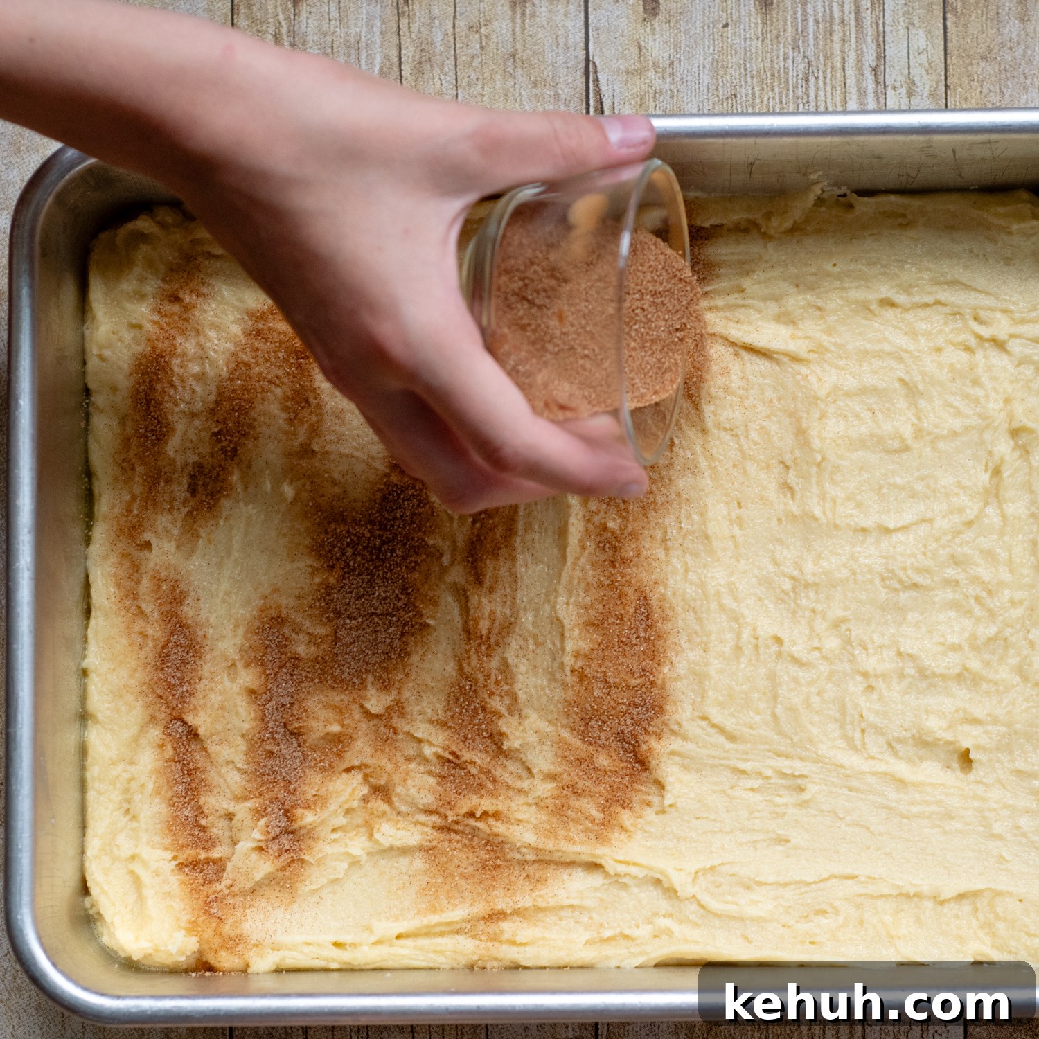 Gooey Snickerdoodle Bars with Cinnamon Frosting Recipe 6 sprinkling cinnamon and sugar on the unbaked bars.