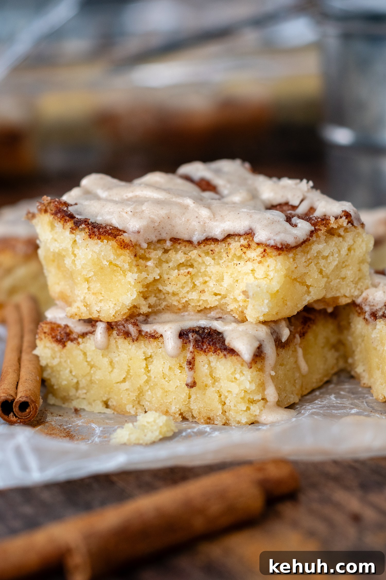 Gooey Snickerdoodle Bars with Cinnamon Frosting Recipe 7 a bite taken out of the bar with frosting out.