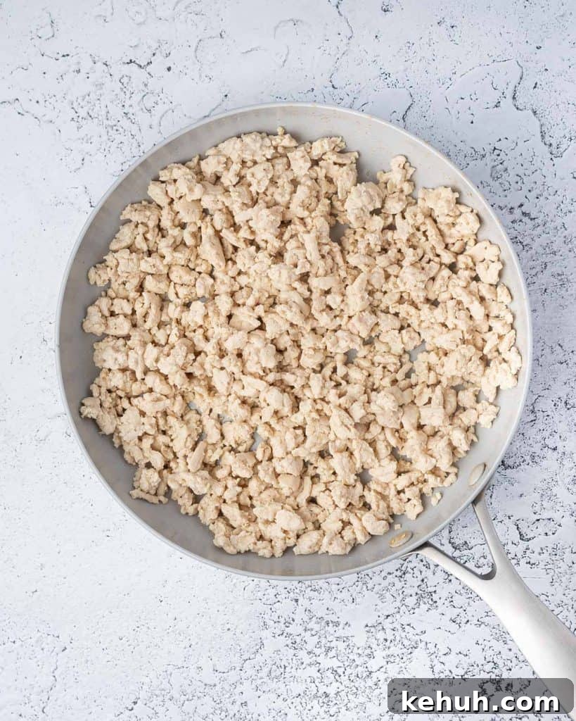 Cooked ground chicken in a pan.