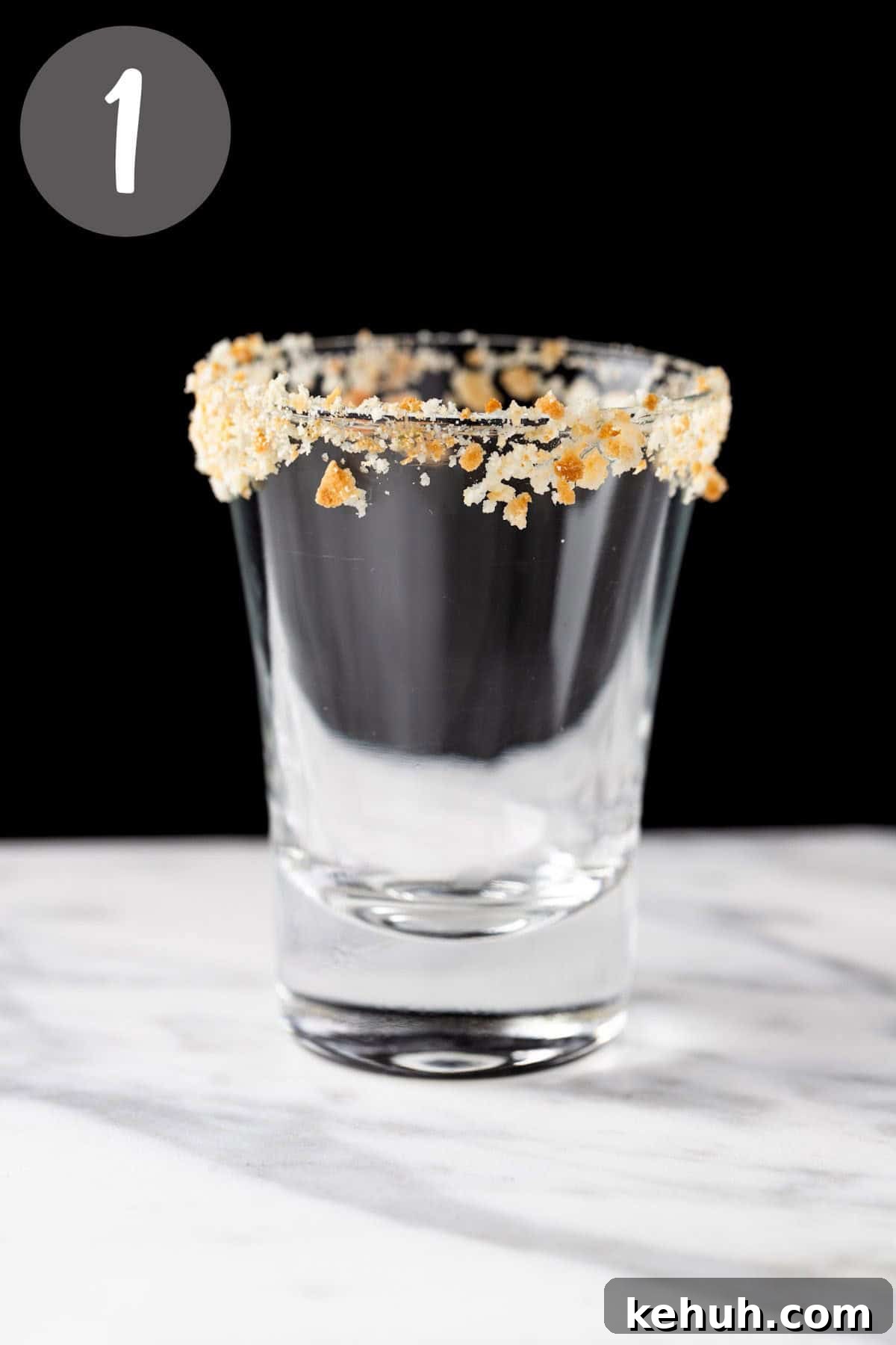 Key Lime Pie Shot Recipe: How to Make the Classic Cocktail Shooter 4 A shot glass with a graham cracker rim.