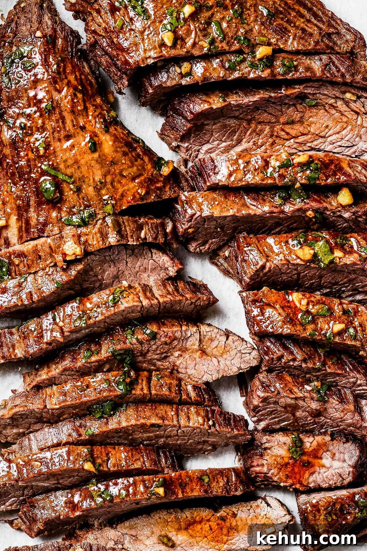 Instant Pot Carne Asada Recipe — Quick Tender Steak Dinner 2 Sliced cooked steak on a cutting board.