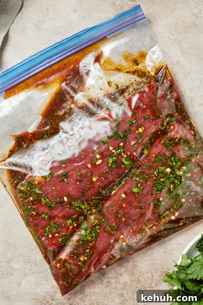 Instant Pot Carne Asada Recipe — Quick Tender Steak Dinner 6 A zip-top bag with flank steak and marinade inside.
