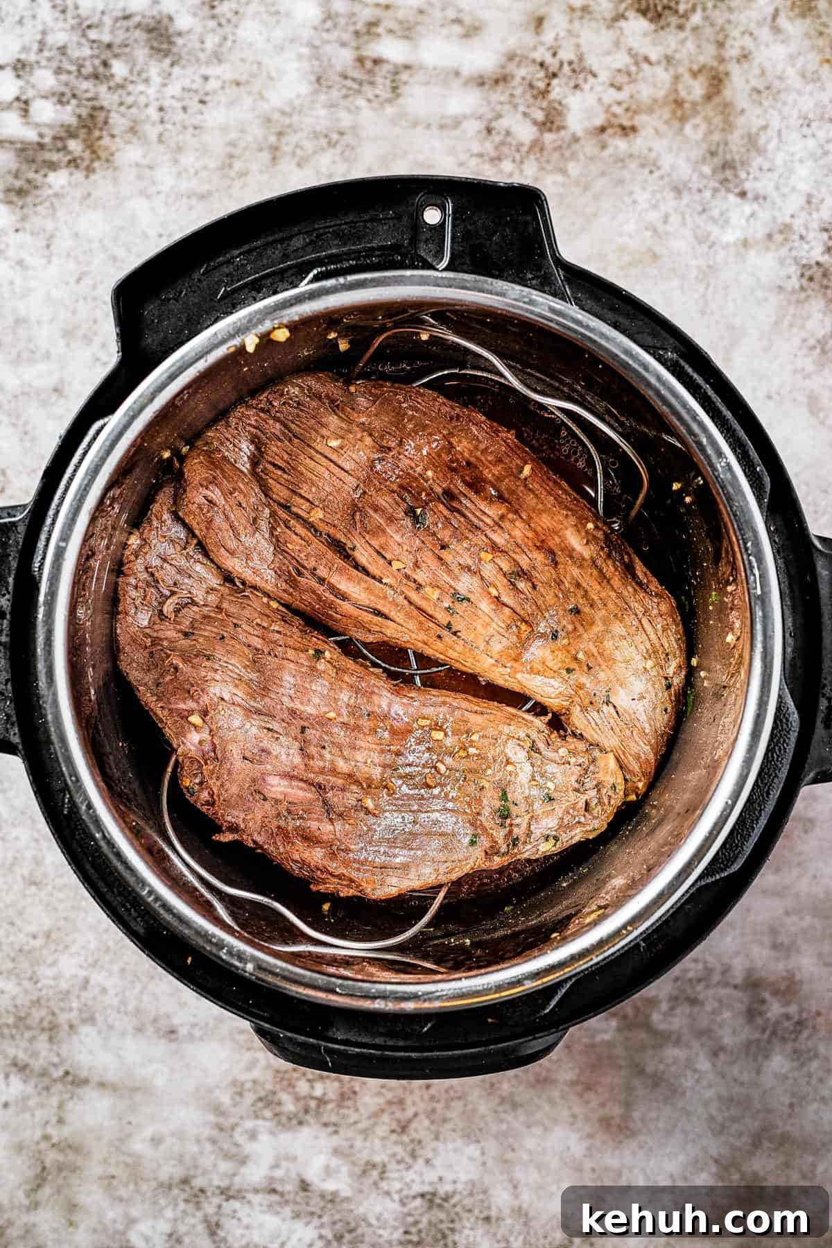 Instant Pot Carne Asada Recipe — Quick Tender Steak Dinner 7 Flank steak browning in an Instant Pot.