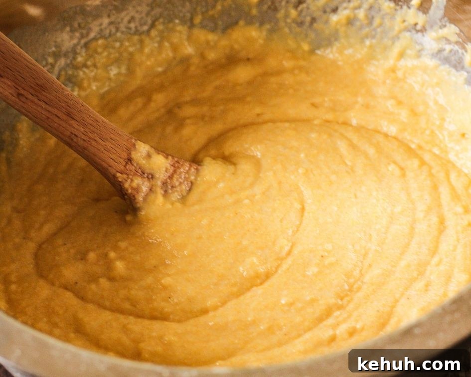 batter for cornbread in a silver bowl