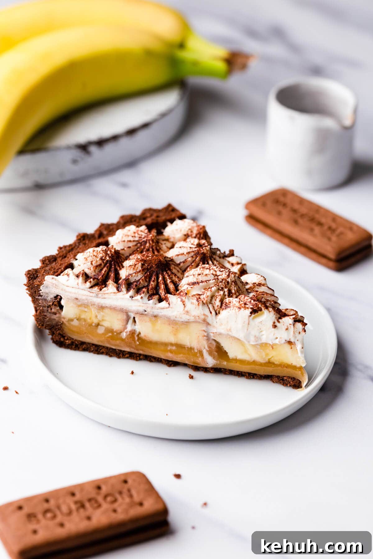 Decadent Vegan Banoffee Pie Recipe for Creamy Caramel Banana Dessert 2 side close up at a slice of vegan banoffee pie on a dessert plate