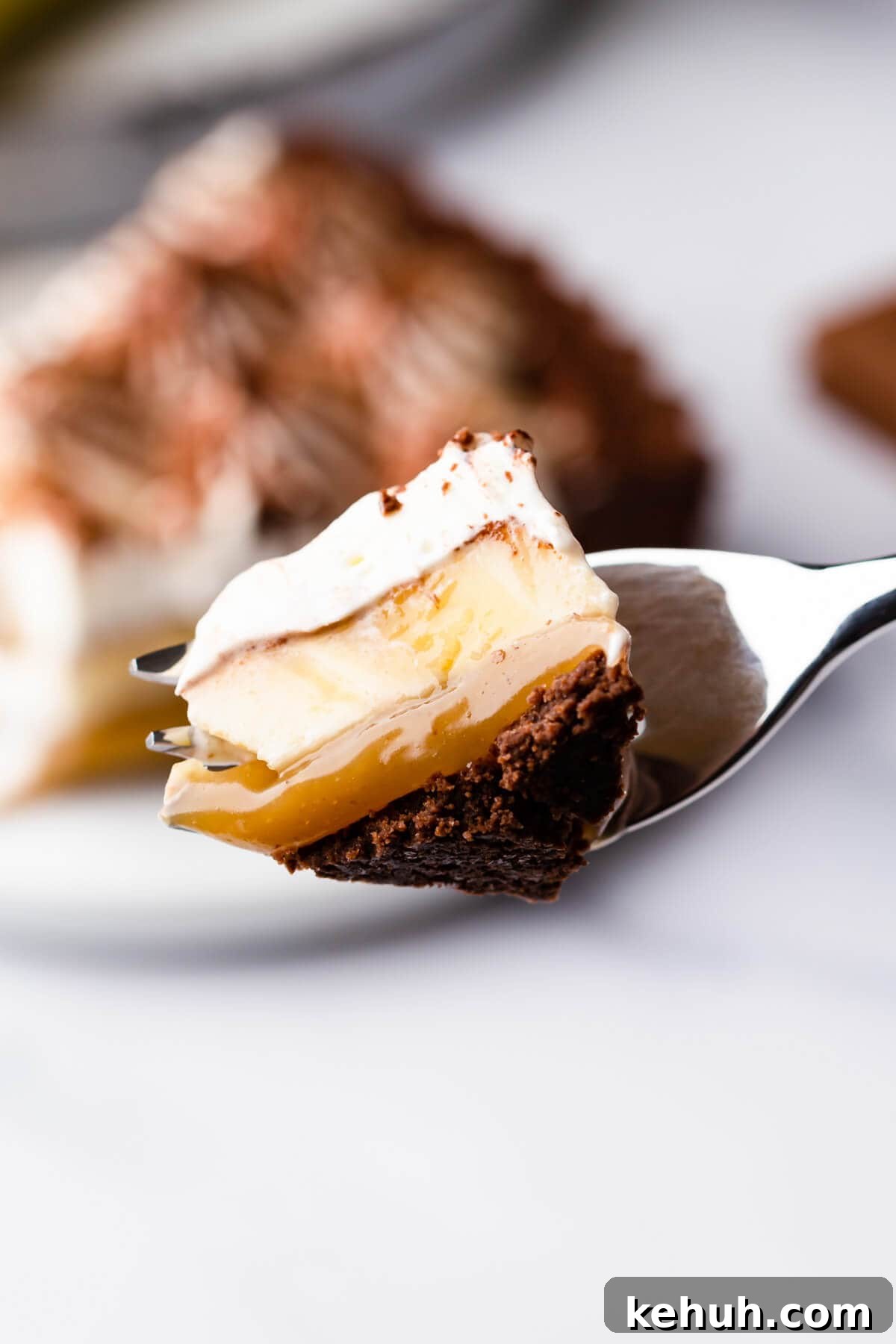 Decadent Vegan Banoffee Pie Recipe for Creamy Caramel Banana Dessert 10 Overhead shot of a chocolate coconut banoffee pie with a slice being cut out