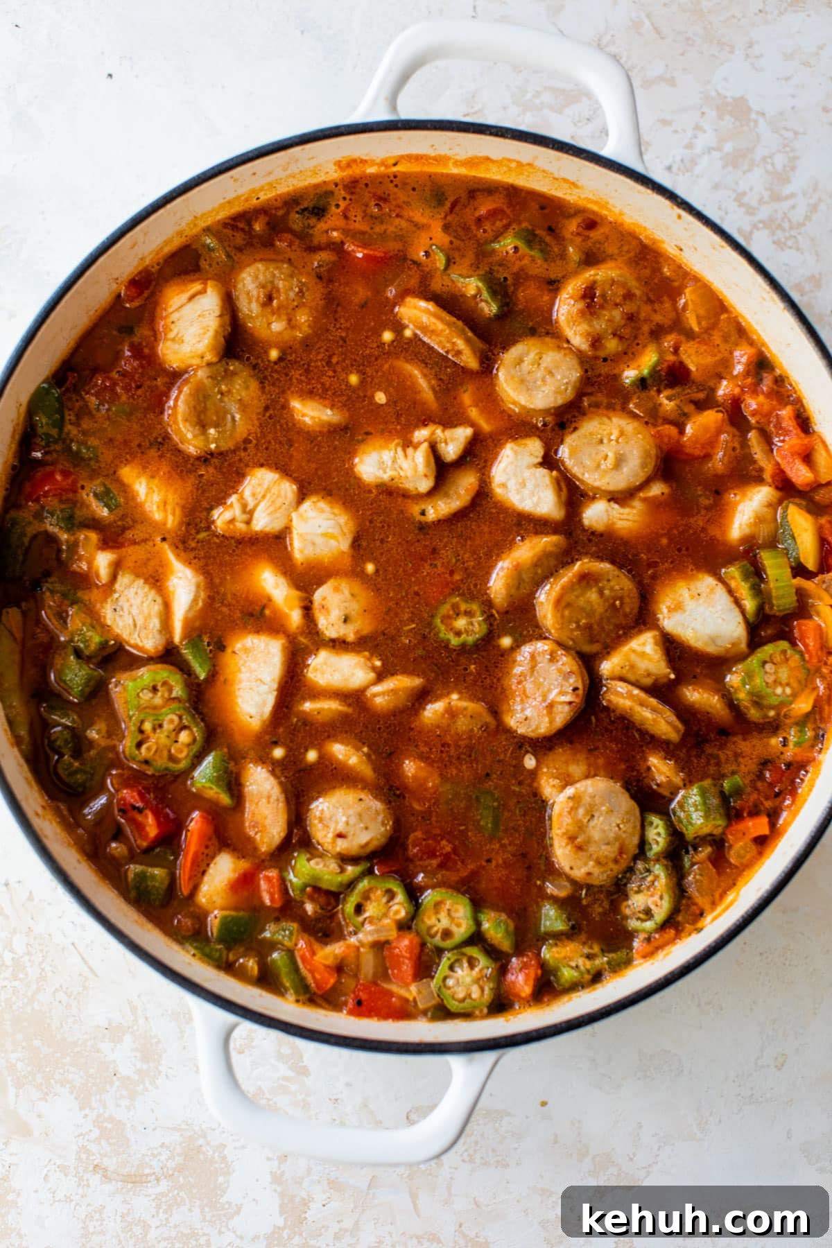 Authentic Chicken and Sausage Jambalaya Recipe for Packed Flavor 5 chicken and sausage added to the dutch oven