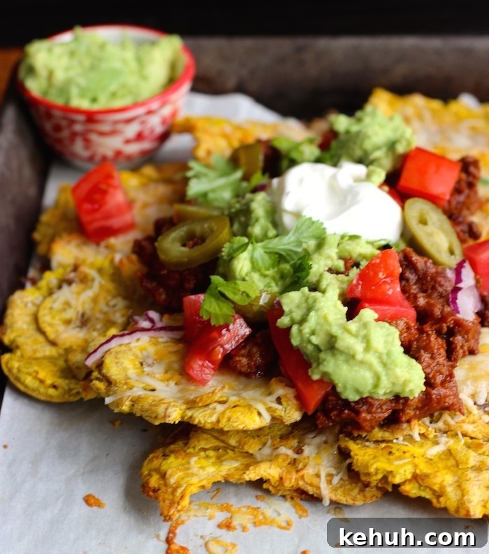 Patacón Nachos: Loaded Plantain Chips with Beef & Cheese 8 Patacón Loaded Nachos