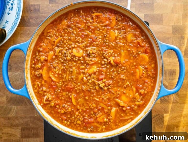 Authentic Greek Lentil Soup (Fakes) — Simple, Flavorful Recipe 11 Step 3 simmering lentil soup until thick and rich with Mediterranean aroma.