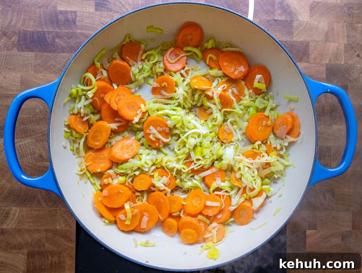 Authentic Greek Lentil Soup (Fakes) — Simple, Flavorful Recipe 4 Step 1 Sautéing onion carrot and leek in olive oil in a large pot.