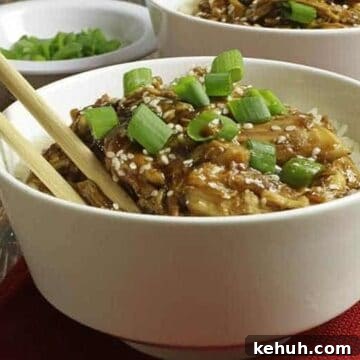 easy honey garlic chicken with sticky sauce in white bowl with chop sticks