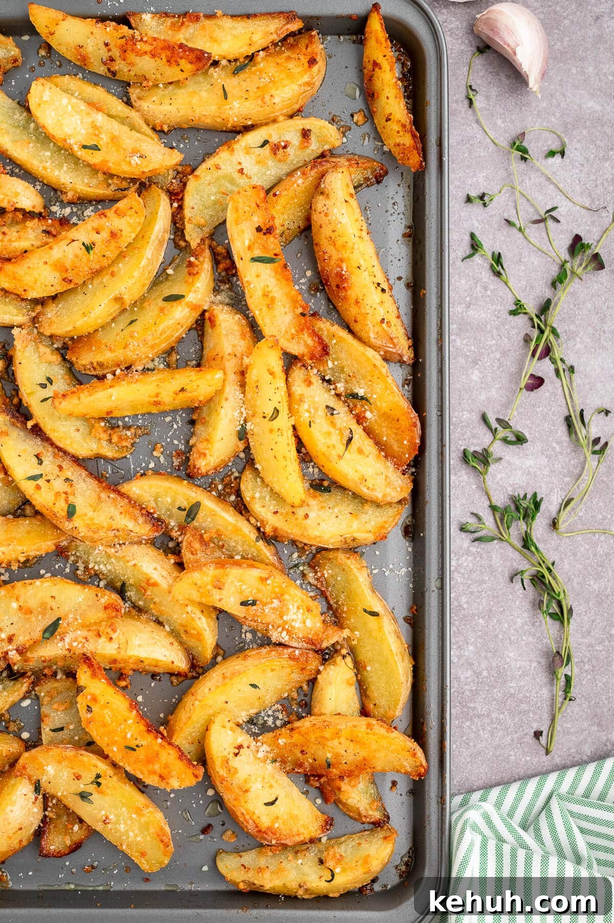 Crispy Parmesan and Thyme Roasted Potatoes Recipe 5 Parmesan thyme roasted potatoes on a baking sheet.
