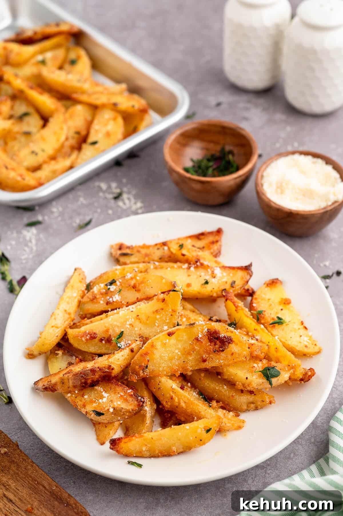 Crispy Parmesan and Thyme Roasted Potatoes Recipe 7 Parmesan thyme roasted potatoes on a plate.