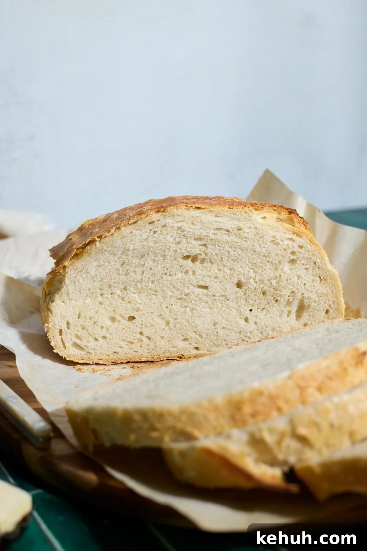 Sourdough Discard Bread Recipe: Crispy Crust, Soft Crumb 12 A loaf of bread cut in half.