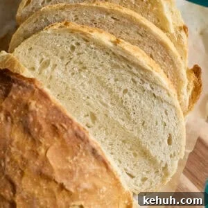 Sourdough Discard Bread Recipe: Crispy Crust, Soft Crumb 13 Slices of a Sourdough Discard Bread on a cutting board.