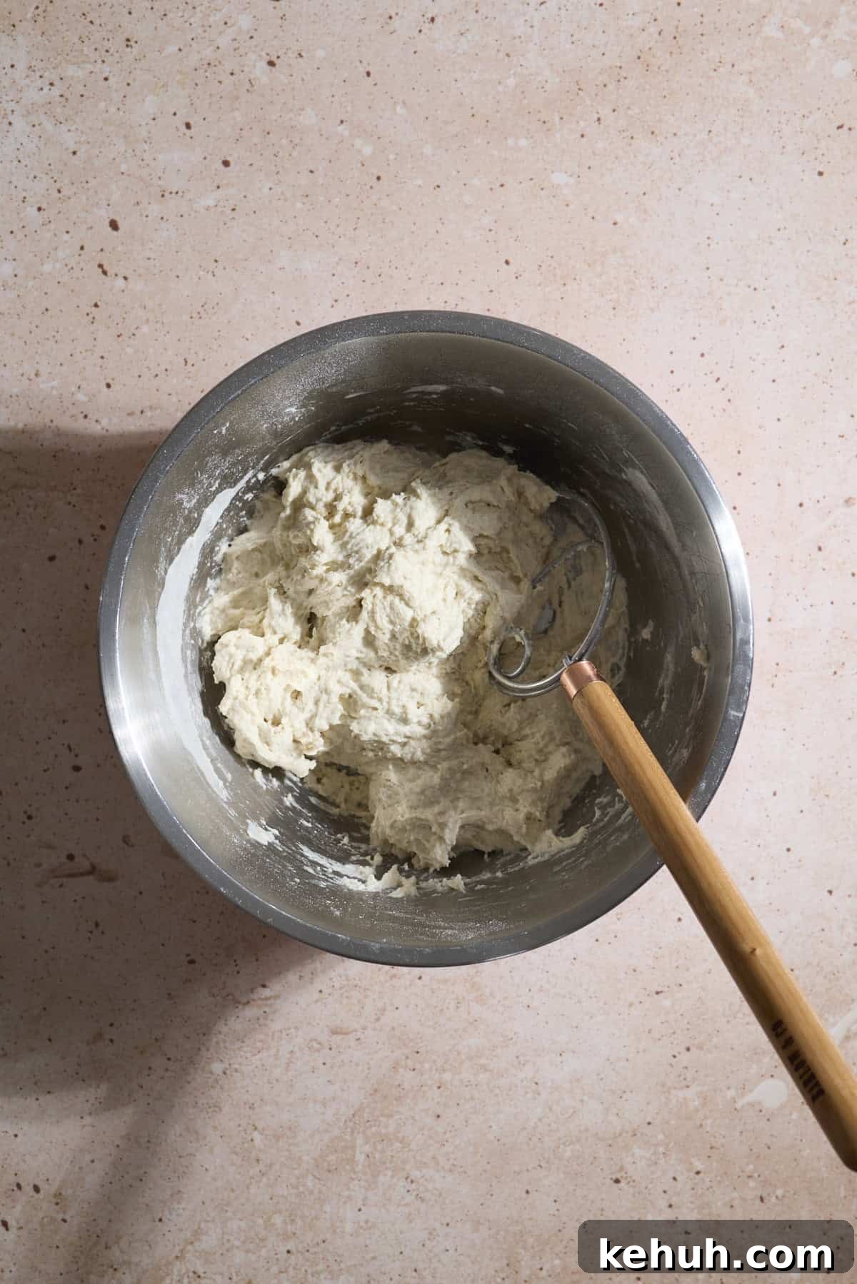 Sourdough Discard Bread Recipe: Crispy Crust, Soft Crumb 4 Dough mixed together in a mixing bowl.