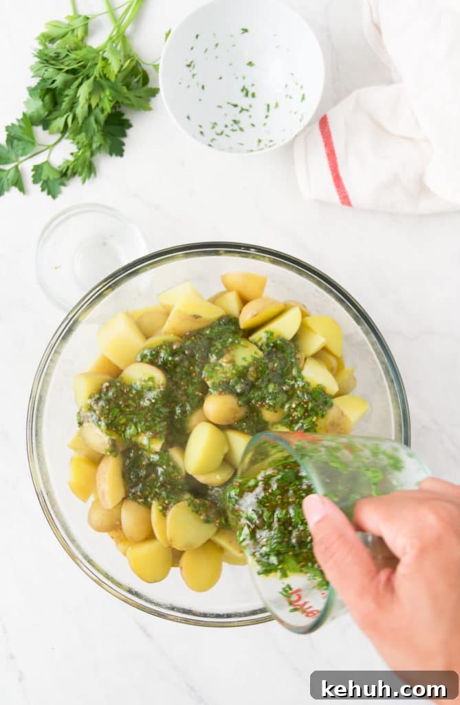 The vinaigrette pours on top of the cooked potatoes