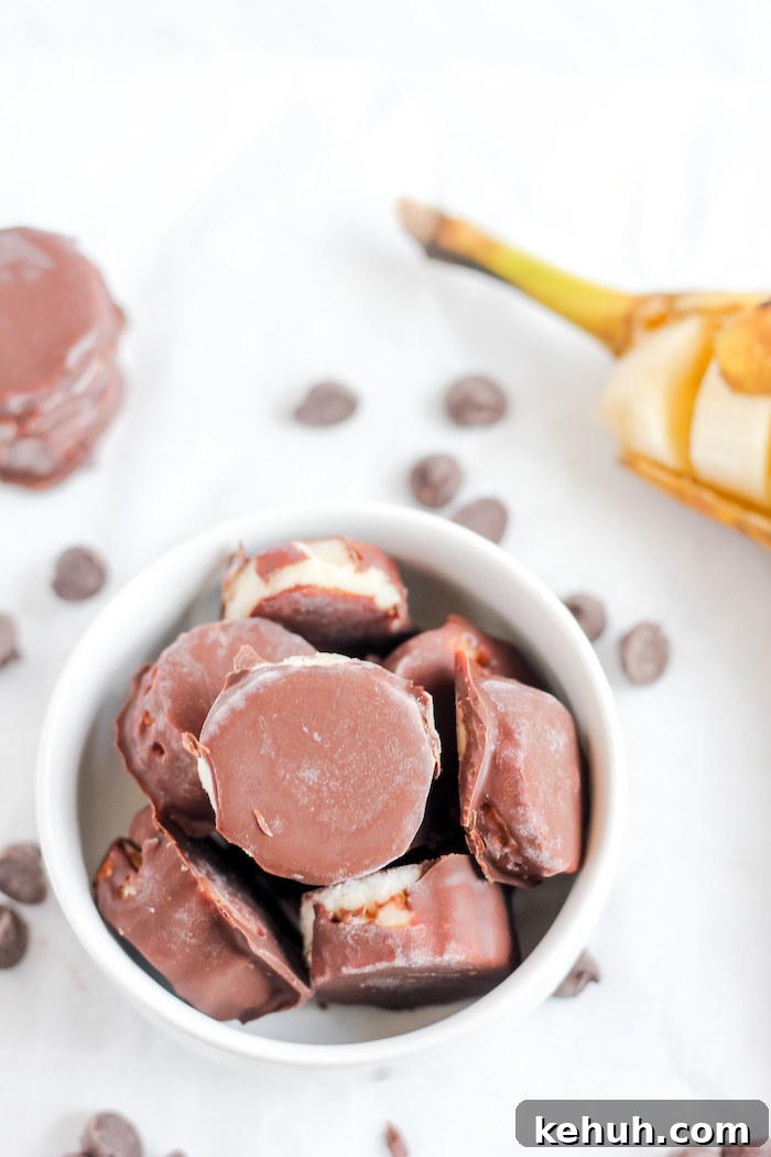 Photo shows a mug of chocolate-covered banana bites taken from above