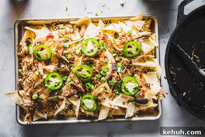 assembling pulled pork nachos 3