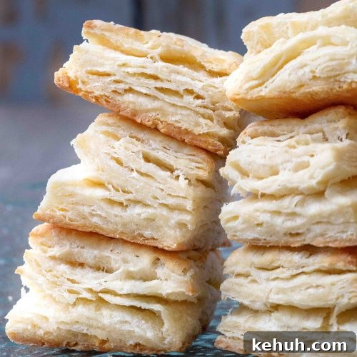 flaky biscuits stacked on top of one another.