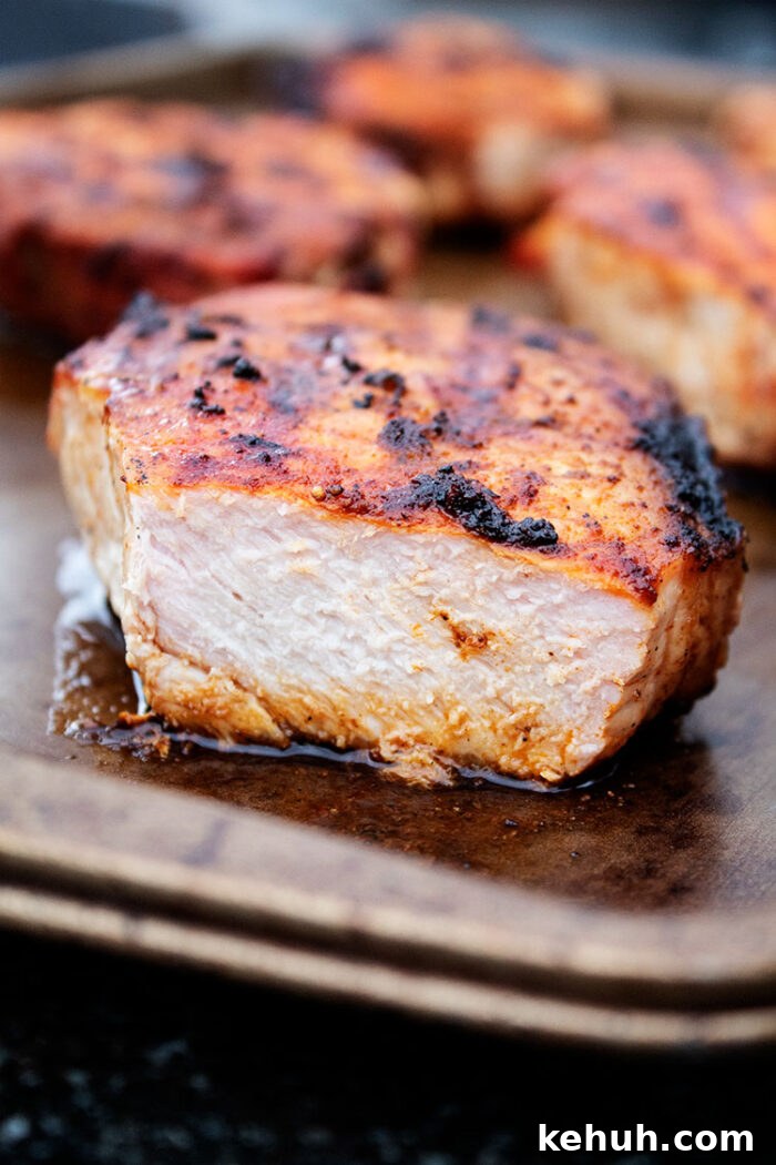 Keto 4th of July Recipes for Your Patriotic Cookout 15 keto grilled pork chops sliced open on a baking sheet