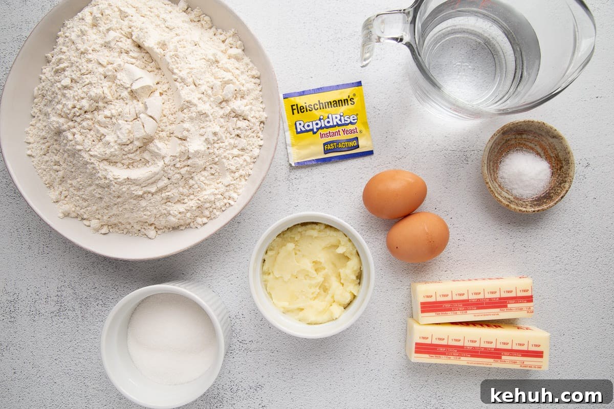 Fluffy Mashed Potato Dinner Rolls: Soft, Buttery Recipe 4 flour, mashed potatoes, butter, eggs, and other ingredients on a white table.