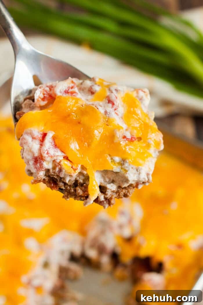 Keto 4th of July Recipes for Your Patriotic Cookout 37 keto casserole beef and tomato on spoon being served