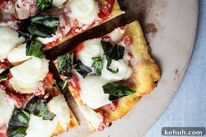 Keto 4th of July Recipes for Your Patriotic Cookout 38 overhead view of keto margherita pizza with slice cut out