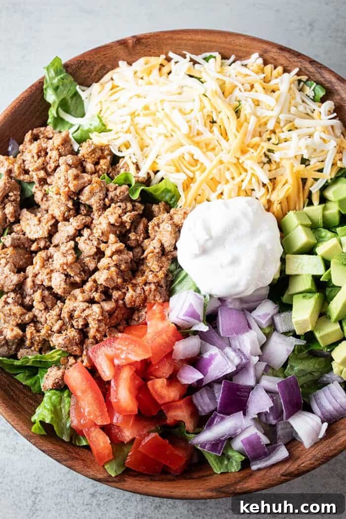 Keto 4th of July Recipes for Your Patriotic Cookout 45 overhead view of turkey taco salad in a wooden bowl