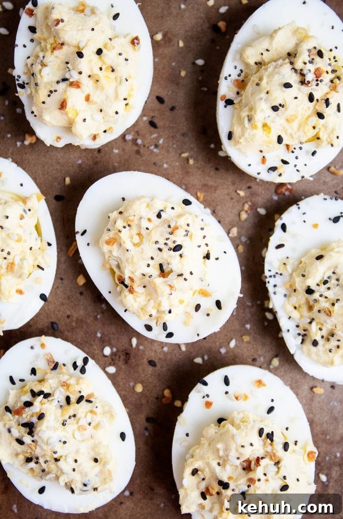 Keto 4th of July Recipes for Your Patriotic Cookout 48 aerial view of keto deviled eggs cut in half and sprinkled with everything bagel seasoning
