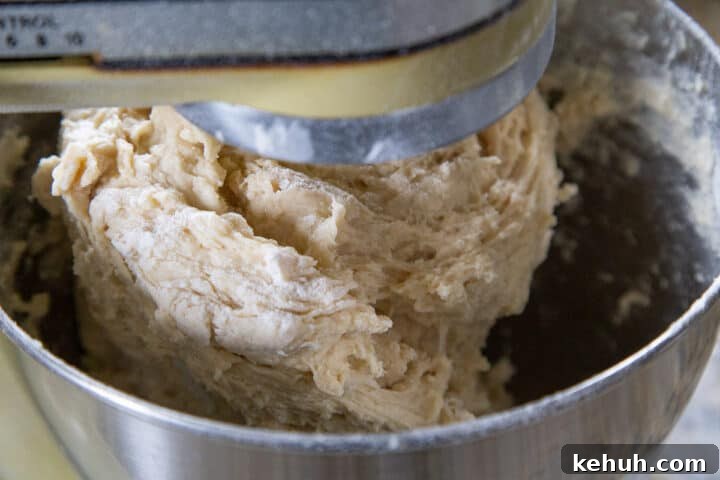 Fluffy Mashed Potato Dinner Rolls: Soft, Buttery Recipe 7 bread dough in a stand mixer bowl.