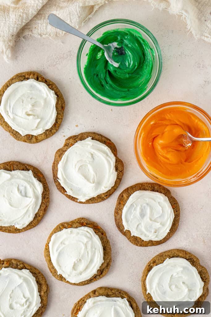 The frosted cookies with tinted buttercream in bowls.