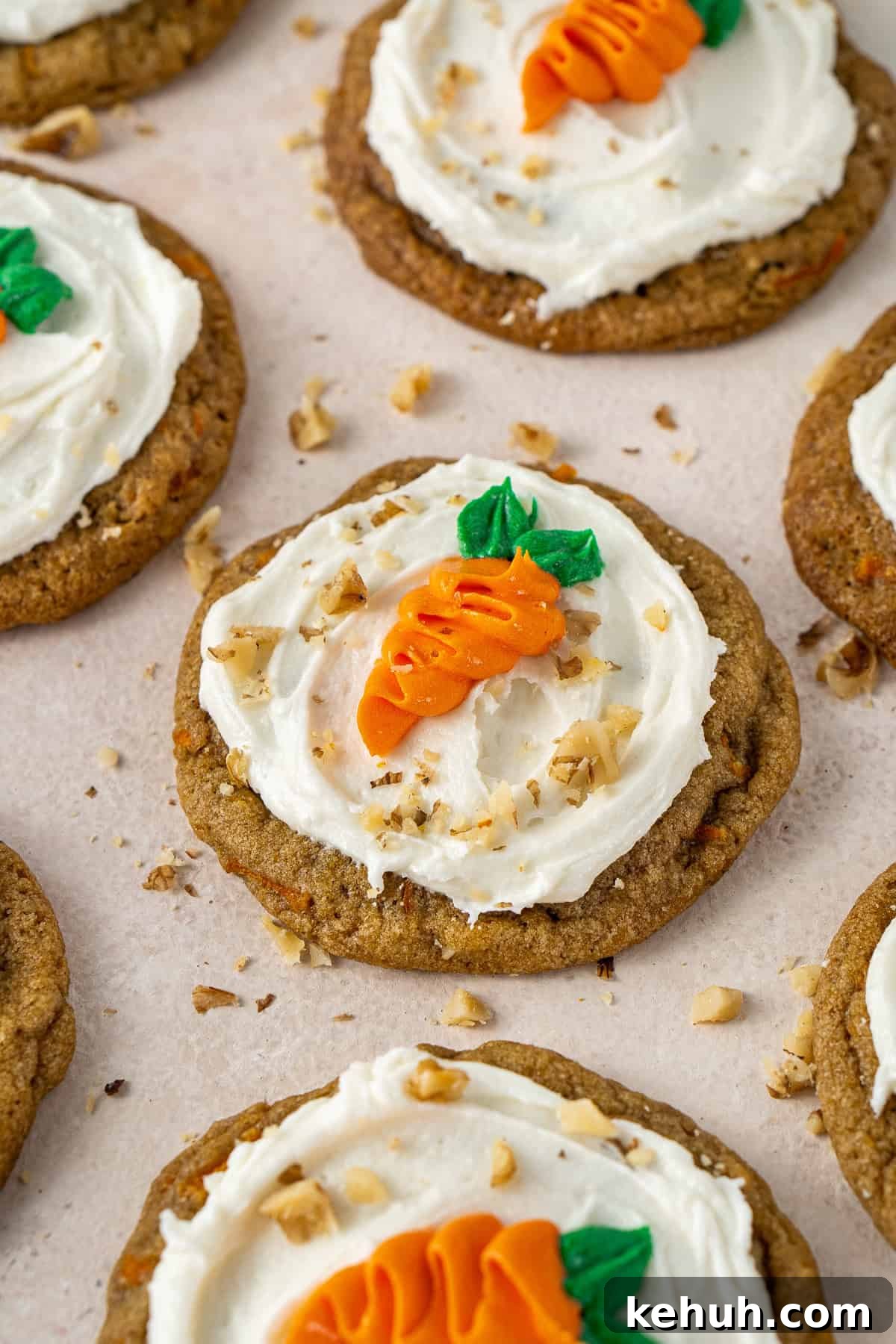 The decorated carrot cake cookies with chopped walnuts.