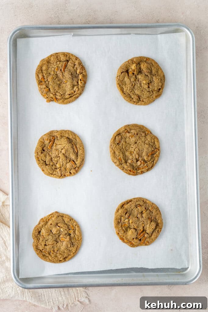 The cooked carrot cake cookies on a baking tray.