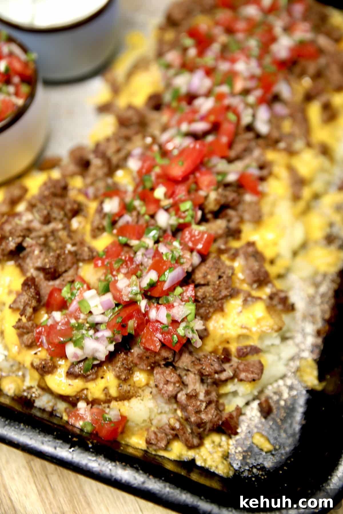 Loaded smashed potatoes with beef and fresh salsa.