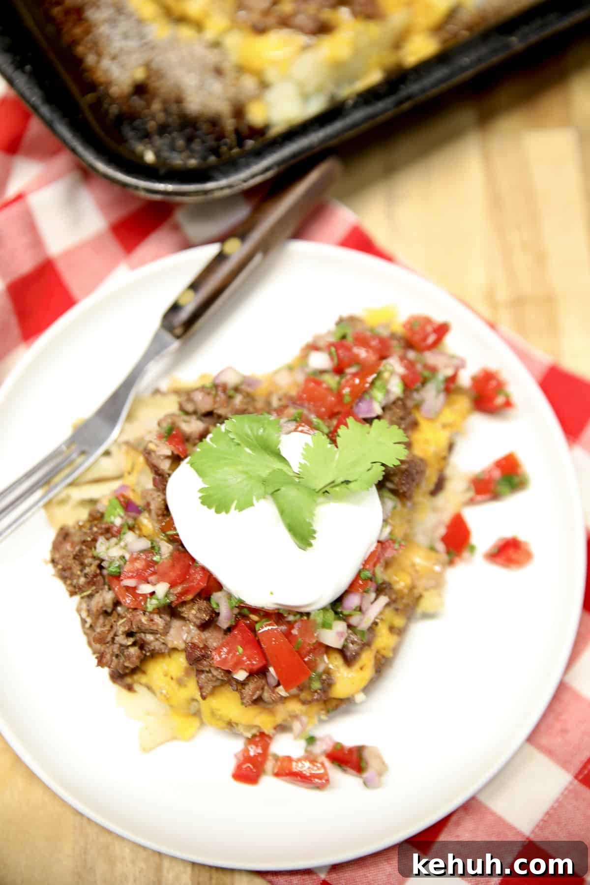 Loaded smashed potatoes with beef, salsa, and sour cream.