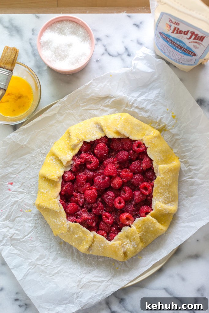 Adding egg wash to Raspberry Galette