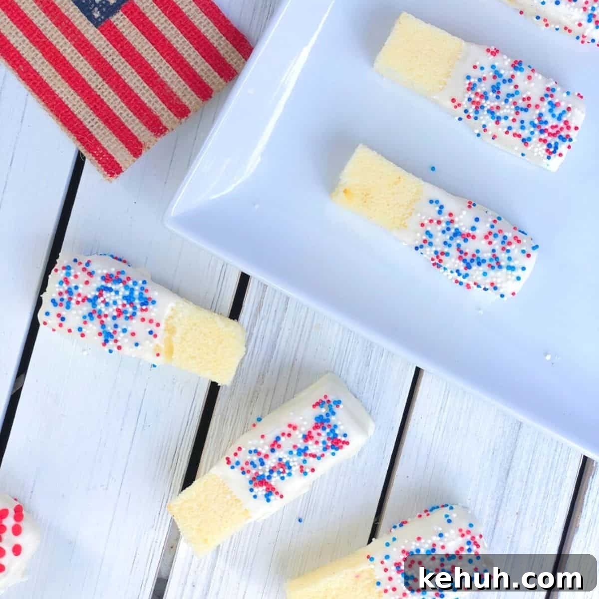 Cake sticks coated in red white and blue sprinkles.