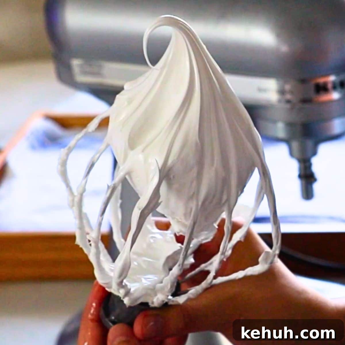 Swiss Meringue Mastery: How to Make Smooth, Glossy Meringue 2 the perfect Swiss meringue on a whisk for Swiss buttercream