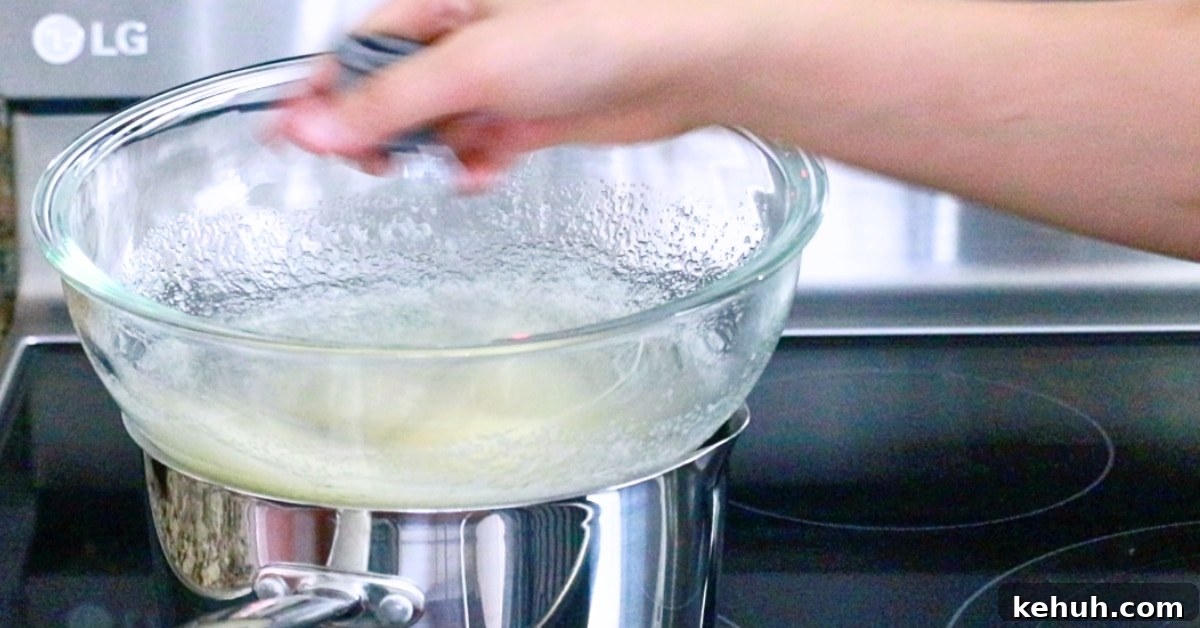 Swiss Meringue Mastery: How to Make Smooth, Glossy Meringue 5 mixing egg whites and sugar with a whisk